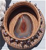 Basket of Jewels features a gorgeous natural agate slice complete with valve, and
gemstone chip bead strings dangling from its rim.